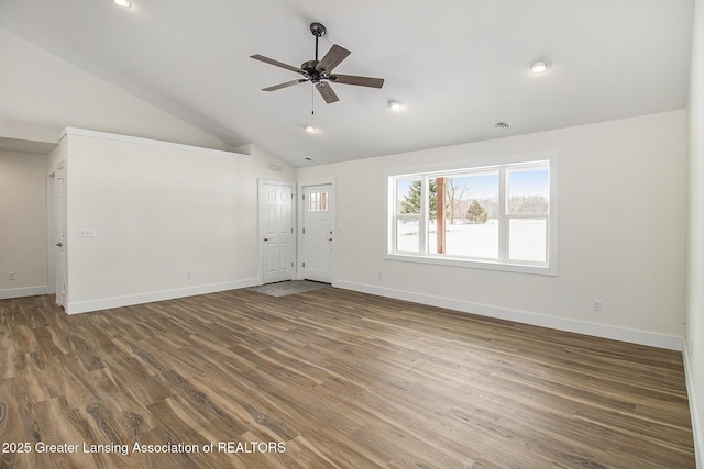 unfurnished living room with ceiling fan, high vaulted ceiling, and dark wood-type flooring