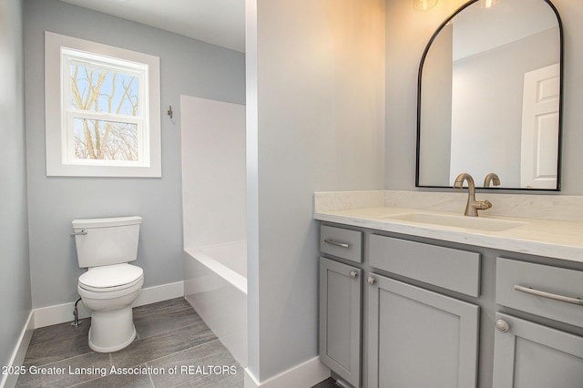 bathroom with toilet and vanity