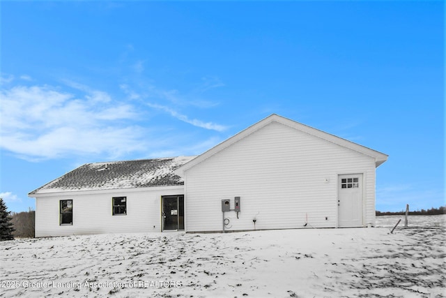 view of snow covered property