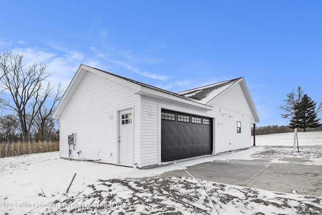 view of snow covered garage