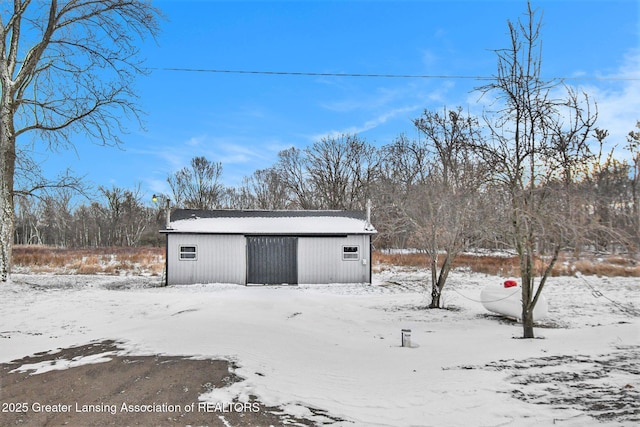 view of snow covered garage