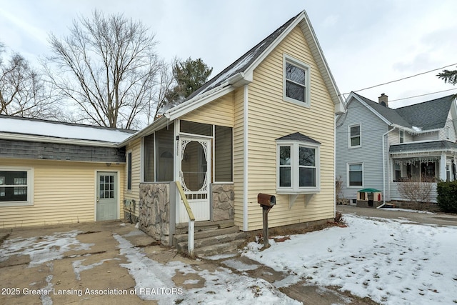 view of front of house featuring a sunroom