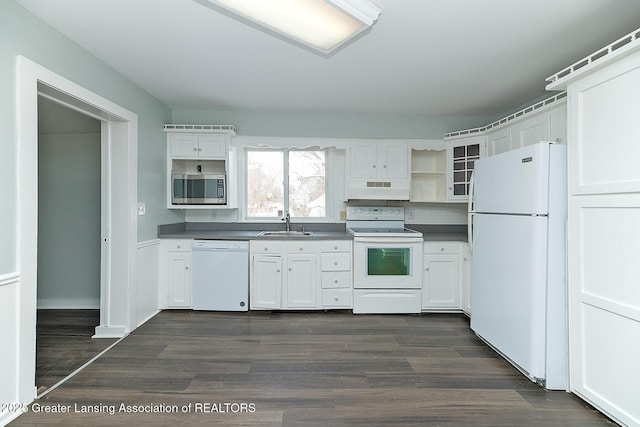 kitchen with white cabinetry, sink, white appliances, and dark hardwood / wood-style floors