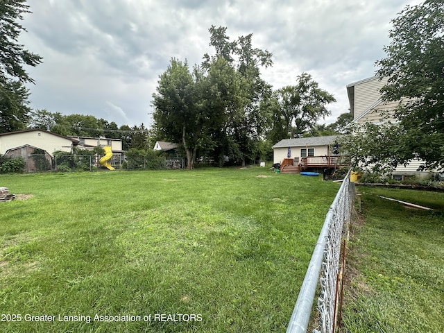 view of yard featuring a wooden deck