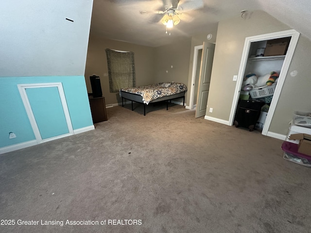 carpeted bedroom featuring vaulted ceiling, ceiling fan, and a closet