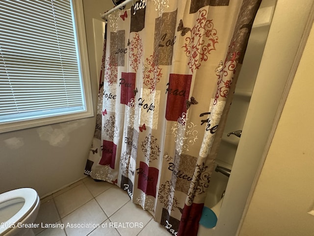 bathroom with walk in shower, tile patterned floors, and toilet