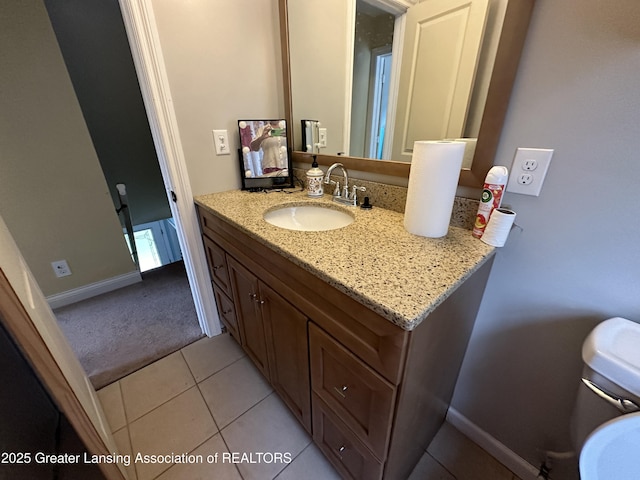 bathroom with tile patterned flooring and vanity