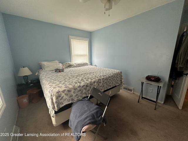 carpeted bedroom featuring ceiling fan