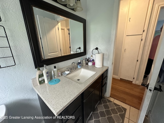 bathroom featuring vanity and tile patterned flooring