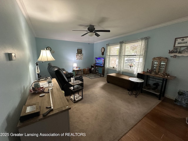 living room featuring crown molding, wood-type flooring, and ceiling fan