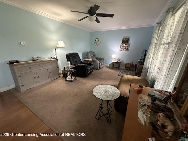 living area featuring crown molding, ceiling fan, and light hardwood / wood-style floors