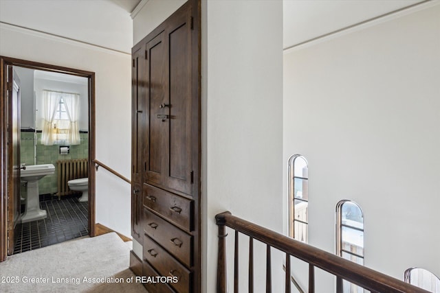 hallway with tile patterned floors