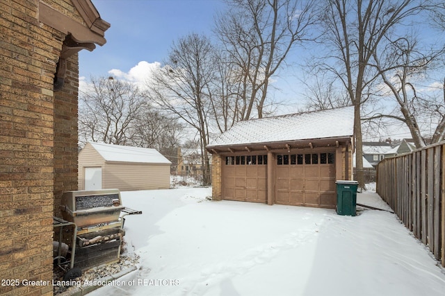 view of snow covered garage