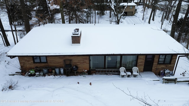 view of snow covered house