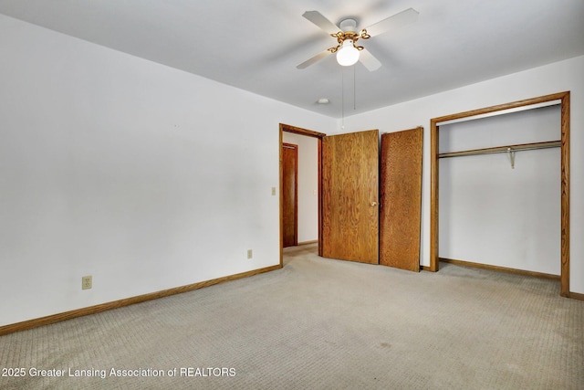 unfurnished bedroom with light carpet, a closet, and ceiling fan