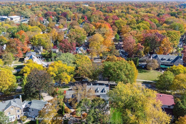 aerial view with a residential view and a wooded view