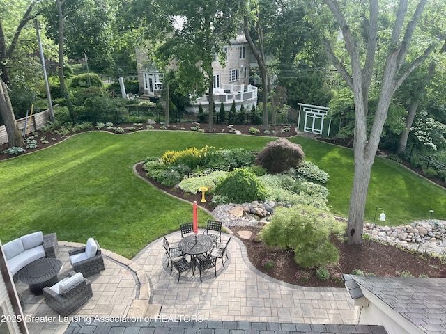 view of yard with fence and a patio