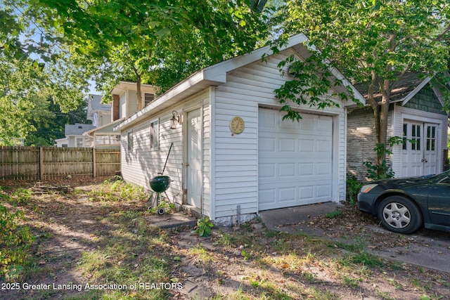 view of side of home with an outbuilding and a garage