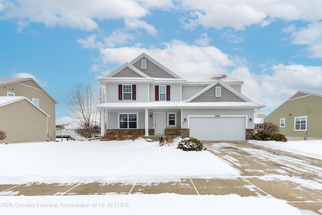 view of front of property with a garage and covered porch