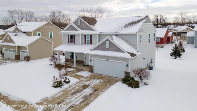 craftsman house with a garage, a residential view, covered porch, and driveway