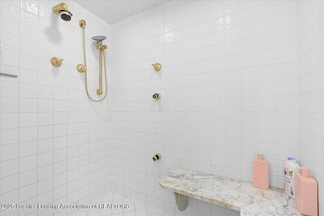 bathroom with a tile shower