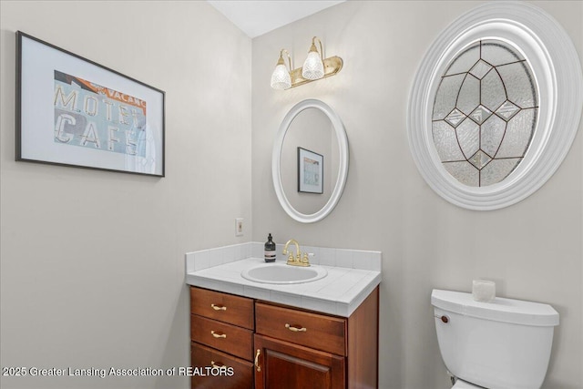 bathroom with vanity and toilet