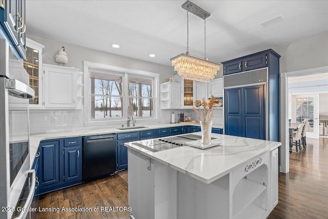 kitchen featuring sink, white cabinetry, tasteful backsplash, black dishwasher, and a kitchen island