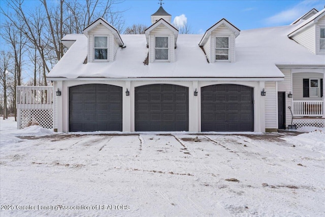 view of snow covered garage