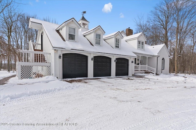 view of front facade featuring a garage and a porch