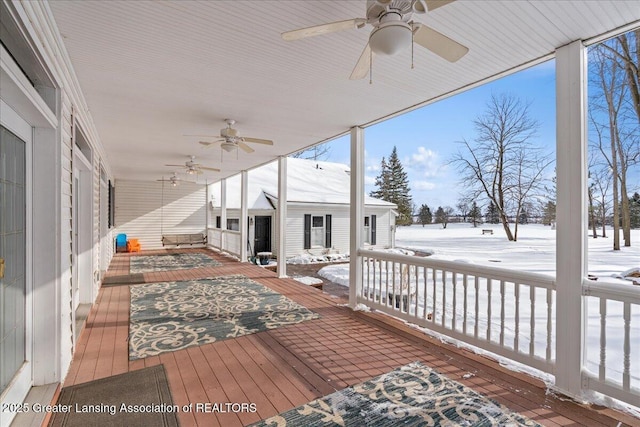 snow covered deck with ceiling fan