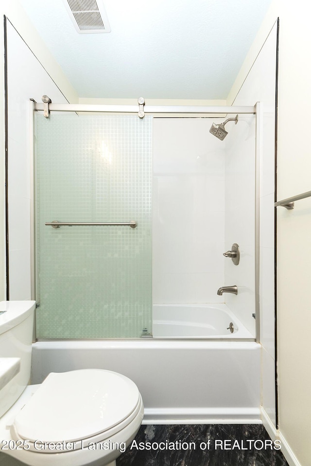 bathroom with shower / bathtub combination and toilet