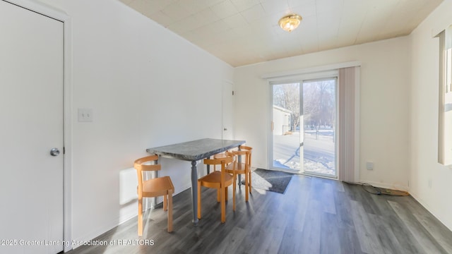 dining space featuring dark hardwood / wood-style floors