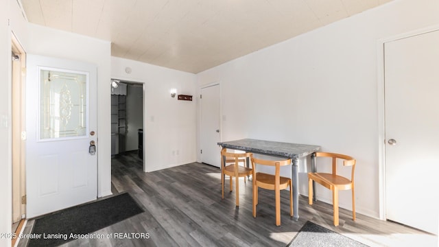 dining space with dark hardwood / wood-style floors