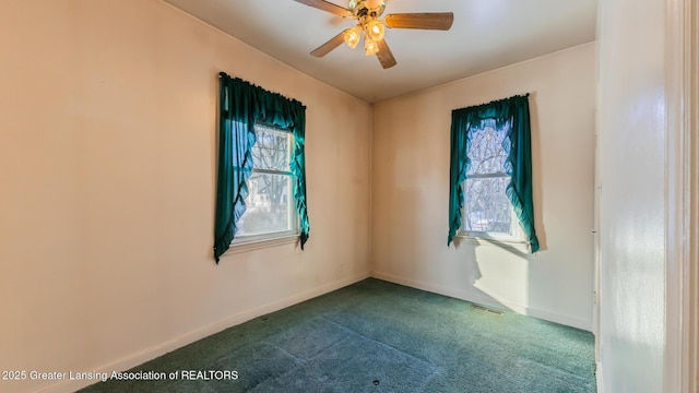 carpeted empty room with ceiling fan