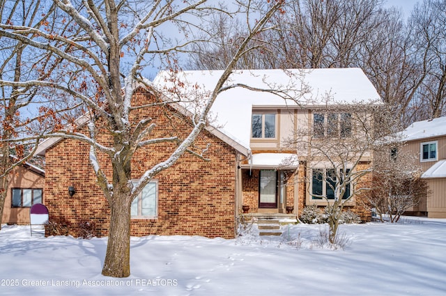 view of front of house featuring brick siding