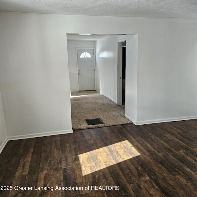 foyer with dark hardwood / wood-style flooring