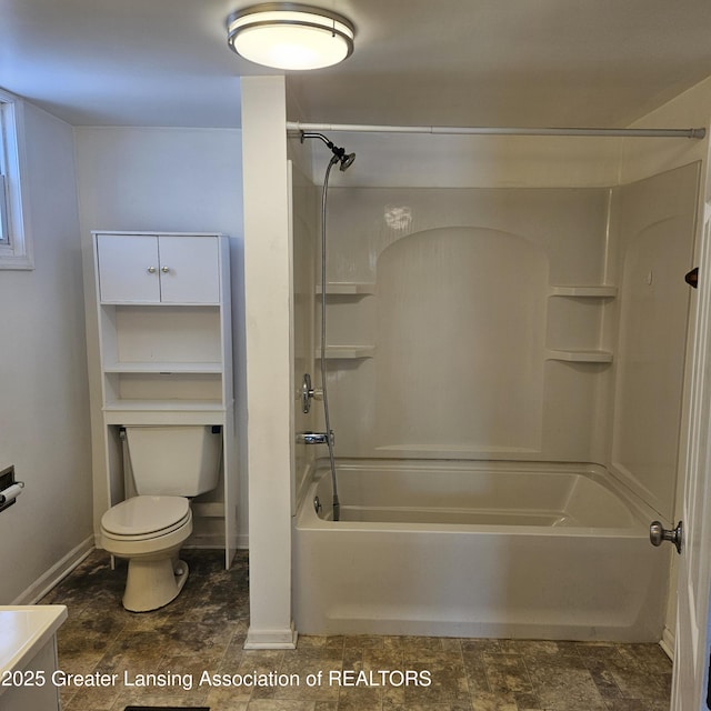 bathroom featuring shower / bathing tub combination and toilet