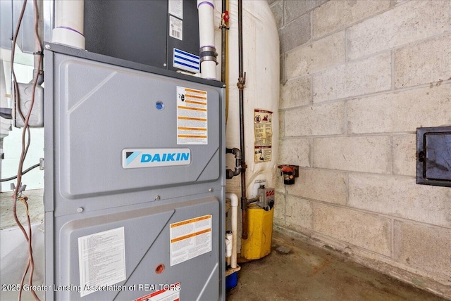 utility room featuring heating unit