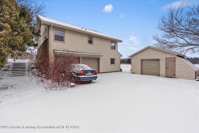 exterior space featuring a garage and an outdoor structure