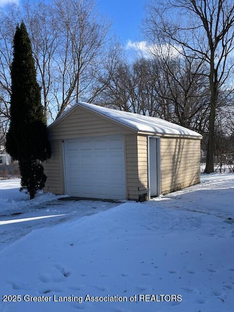 view of snow covered garage