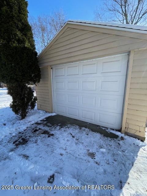 view of snow covered garage