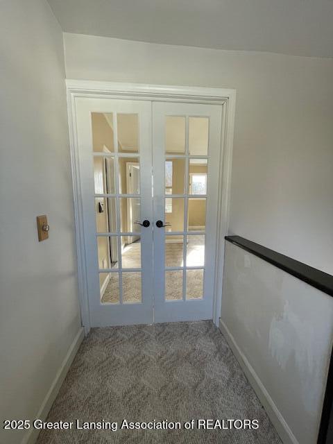 doorway with carpet and french doors