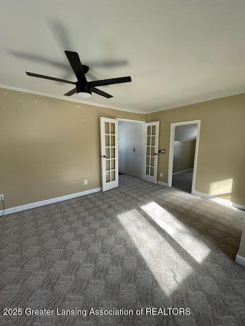 unfurnished room featuring french doors, ceiling fan, ornamental molding, and carpet flooring