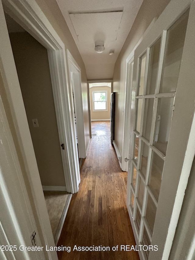 hall with dark wood-type flooring