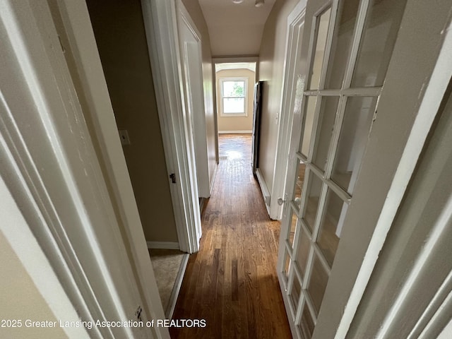 hall with dark wood-type flooring