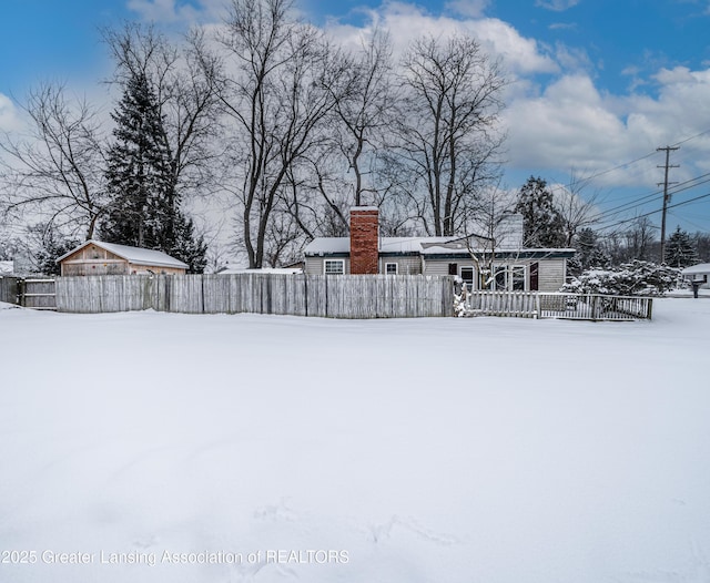 view of yard layered in snow