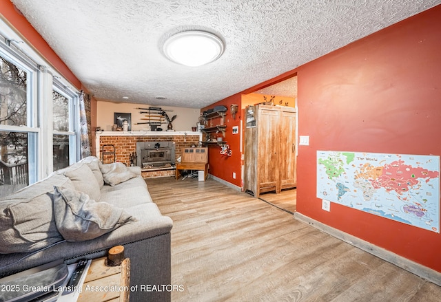 living room with wood-type flooring and a textured ceiling