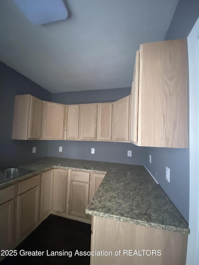 kitchen featuring sink and light brown cabinets