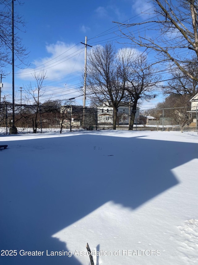 view of yard layered in snow