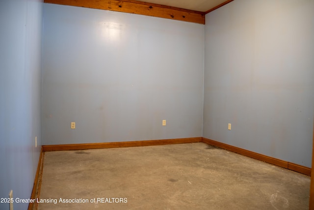 unfurnished room with crown molding